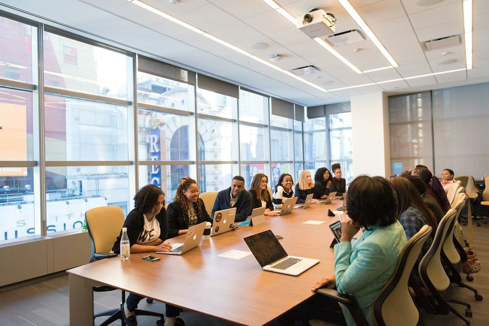 A compliance training session in progress around a boardroom table